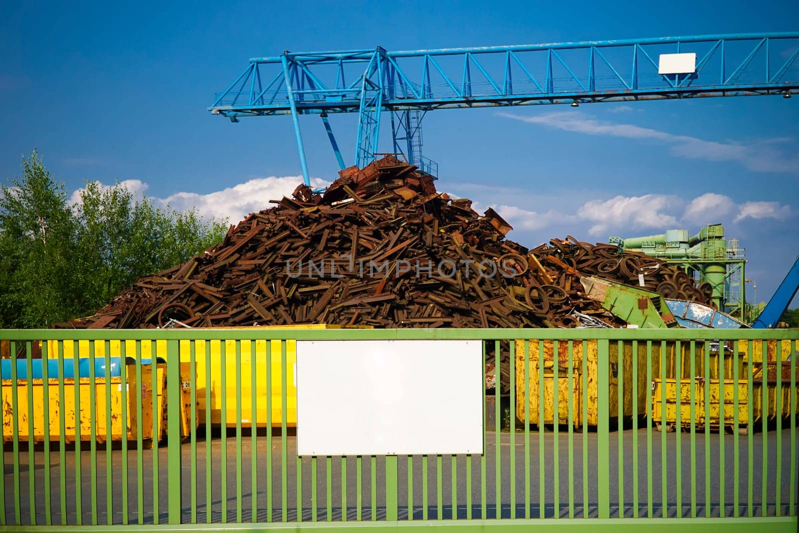Site of a scrap yard with container and crane