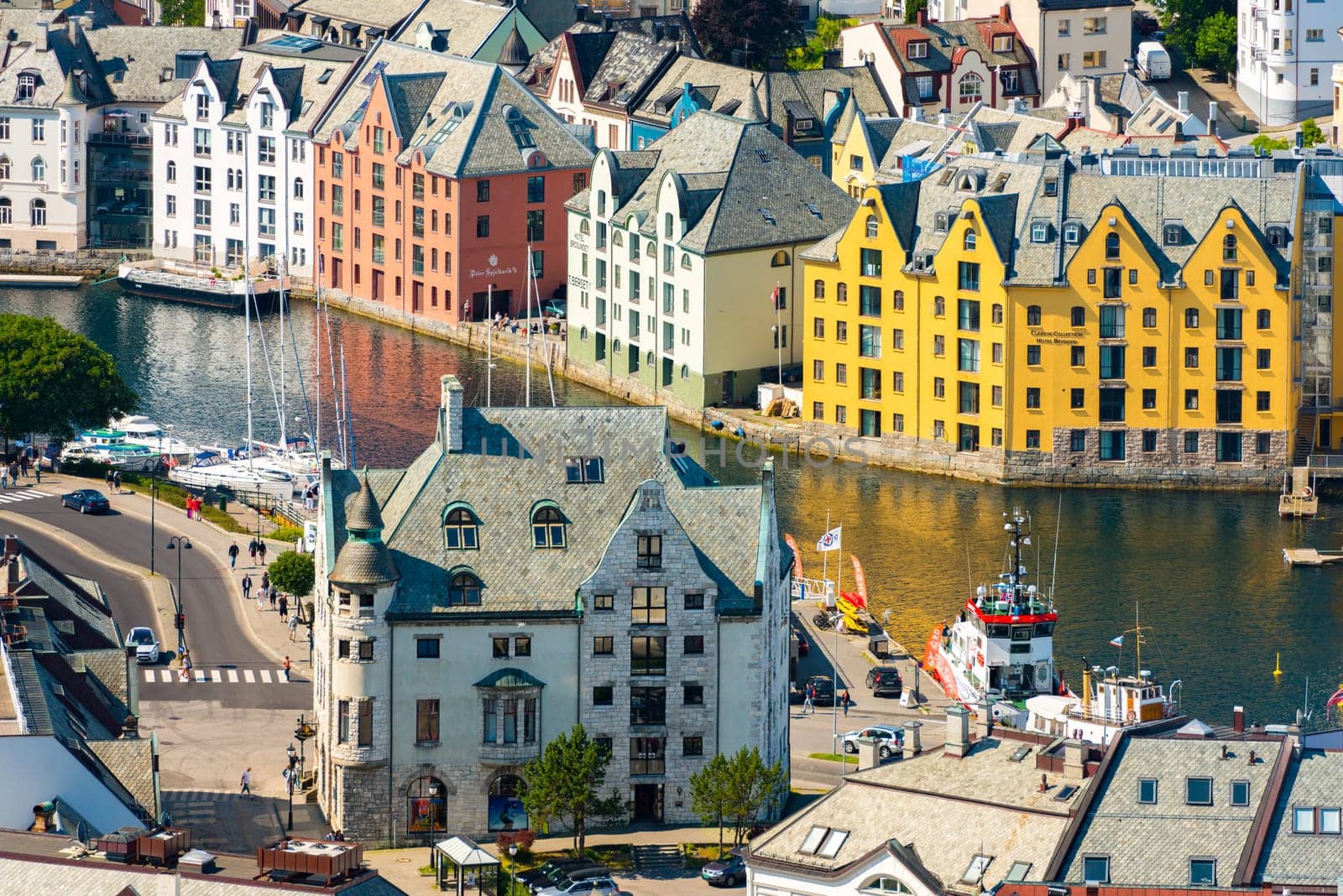 Alesund, Norway - 26 July, 2013: view of central city part with historic art nouveau architectural style in which most of the town was rebuilt after a fire in 1904. Popular tourist destination in Scandinavia, Europe.
