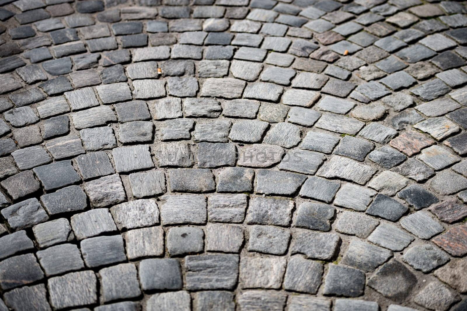 old beautiful cobblestone road in city of Europe