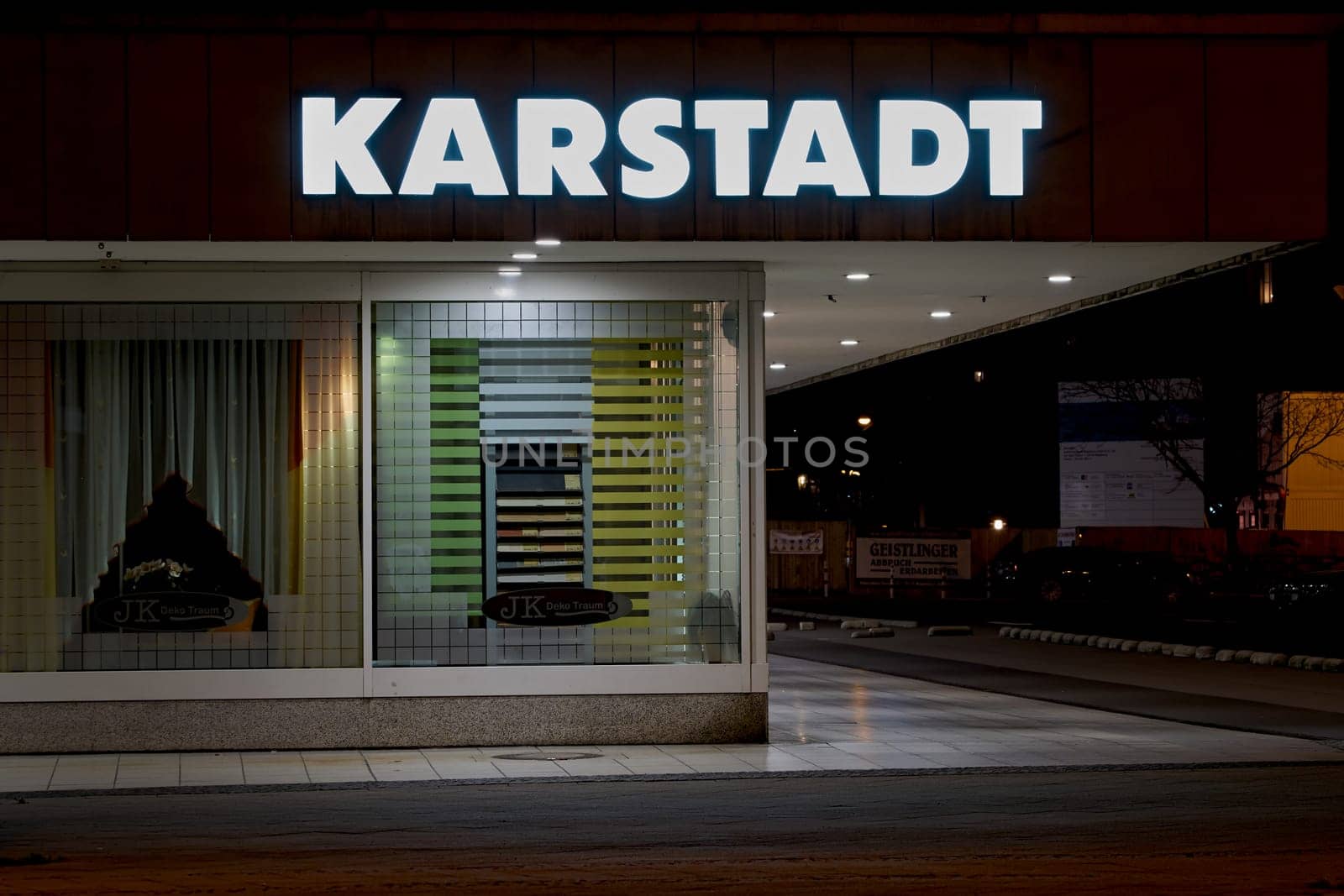 Exterior view of a Karstadt branch in Magdeburg at night. The first Karstadt department store opened in 1881