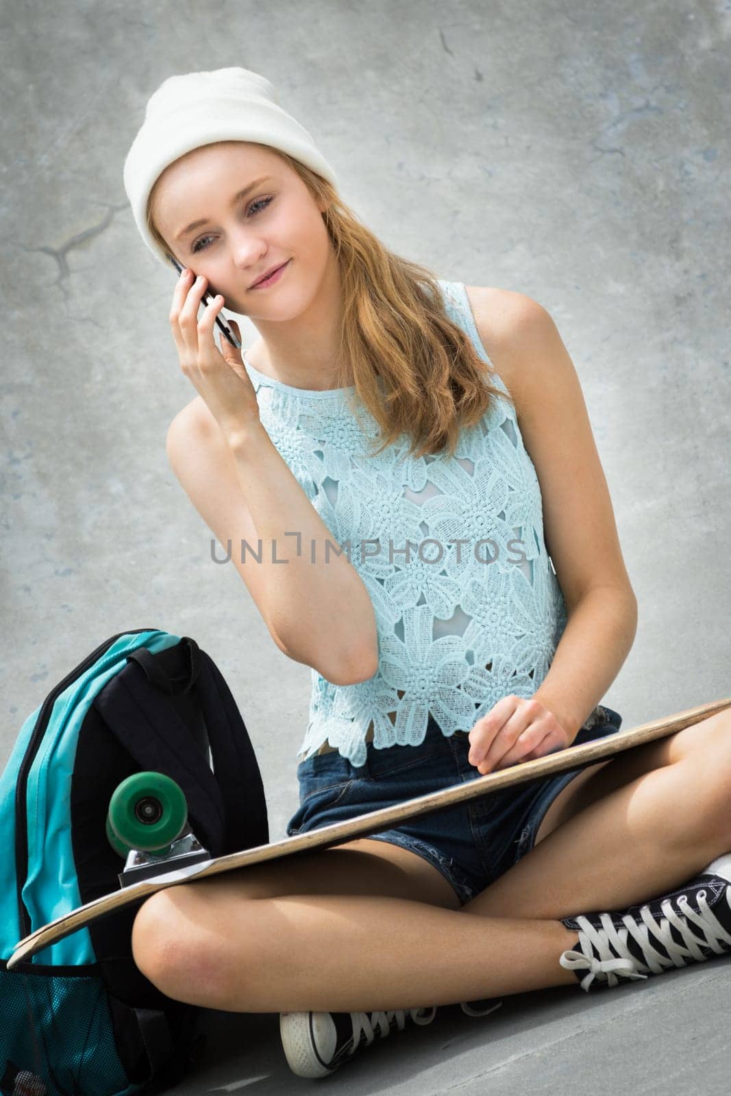 Skater girl talking on cell phone
