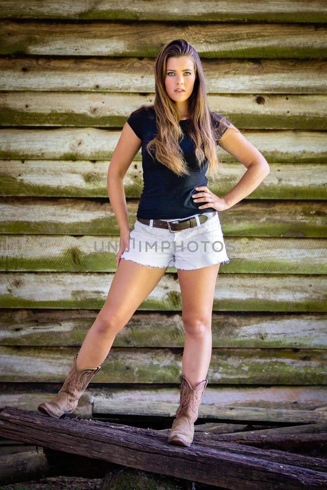 Beautiful country fashion girl wearing boots