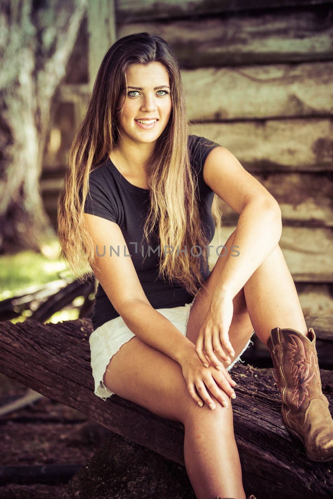 Happy smiling country girl sitting