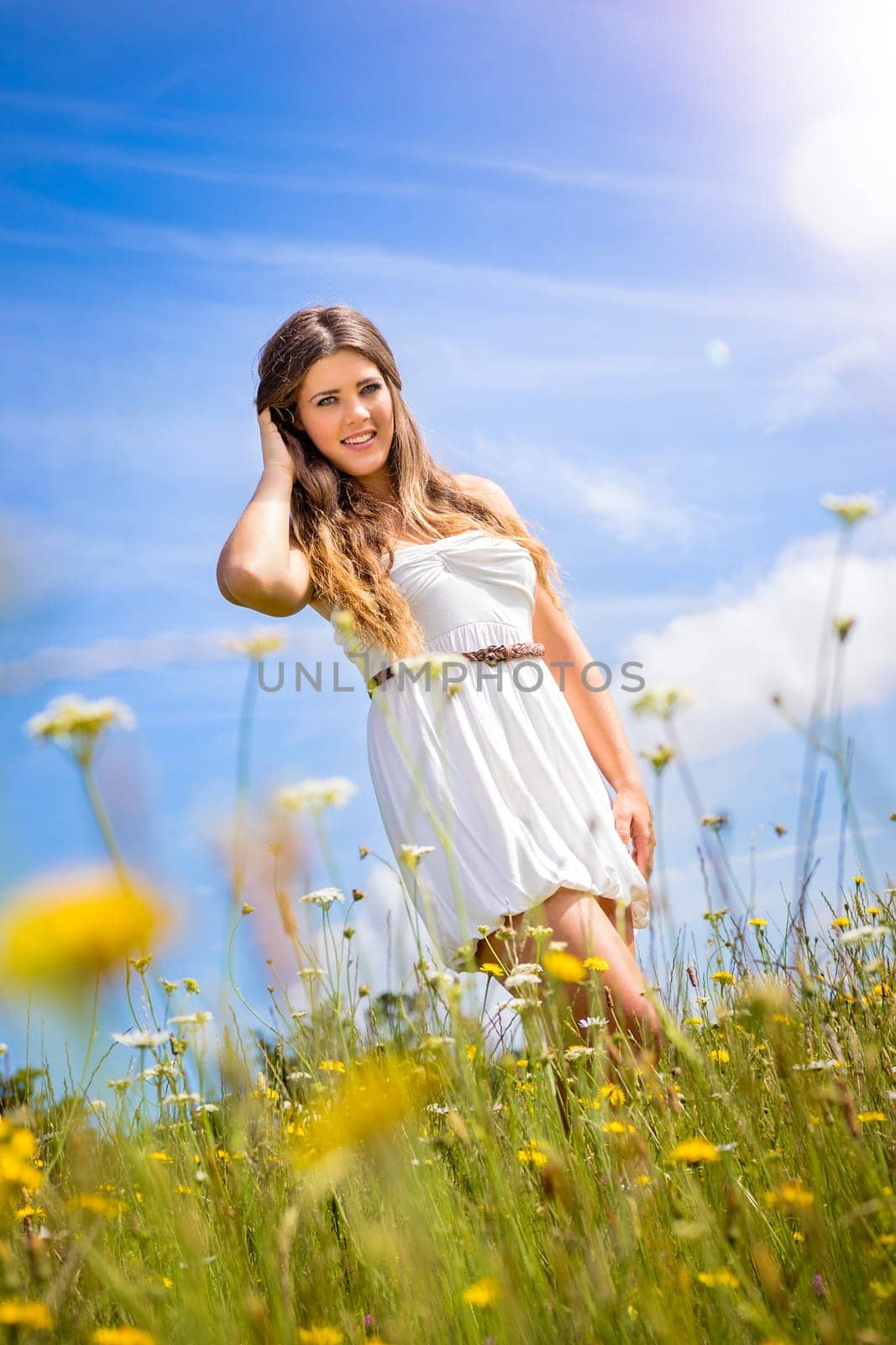 Beautiful woman in field of flowers