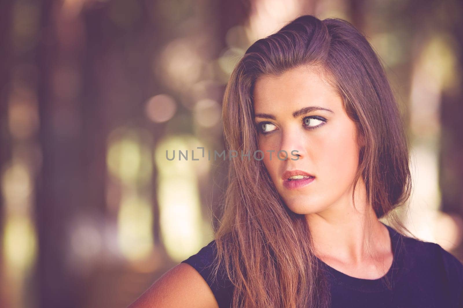 Beautiful young brunette woman with copy space