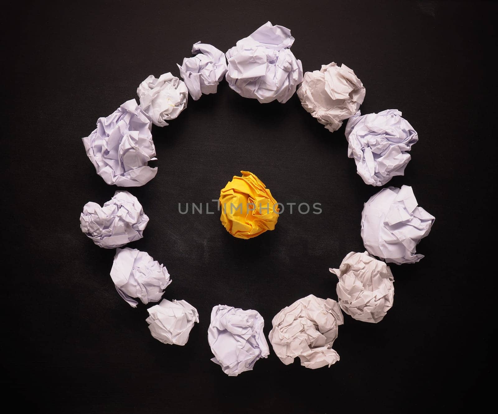 Crumpled paper on a blackboard as symbol of new great ideas