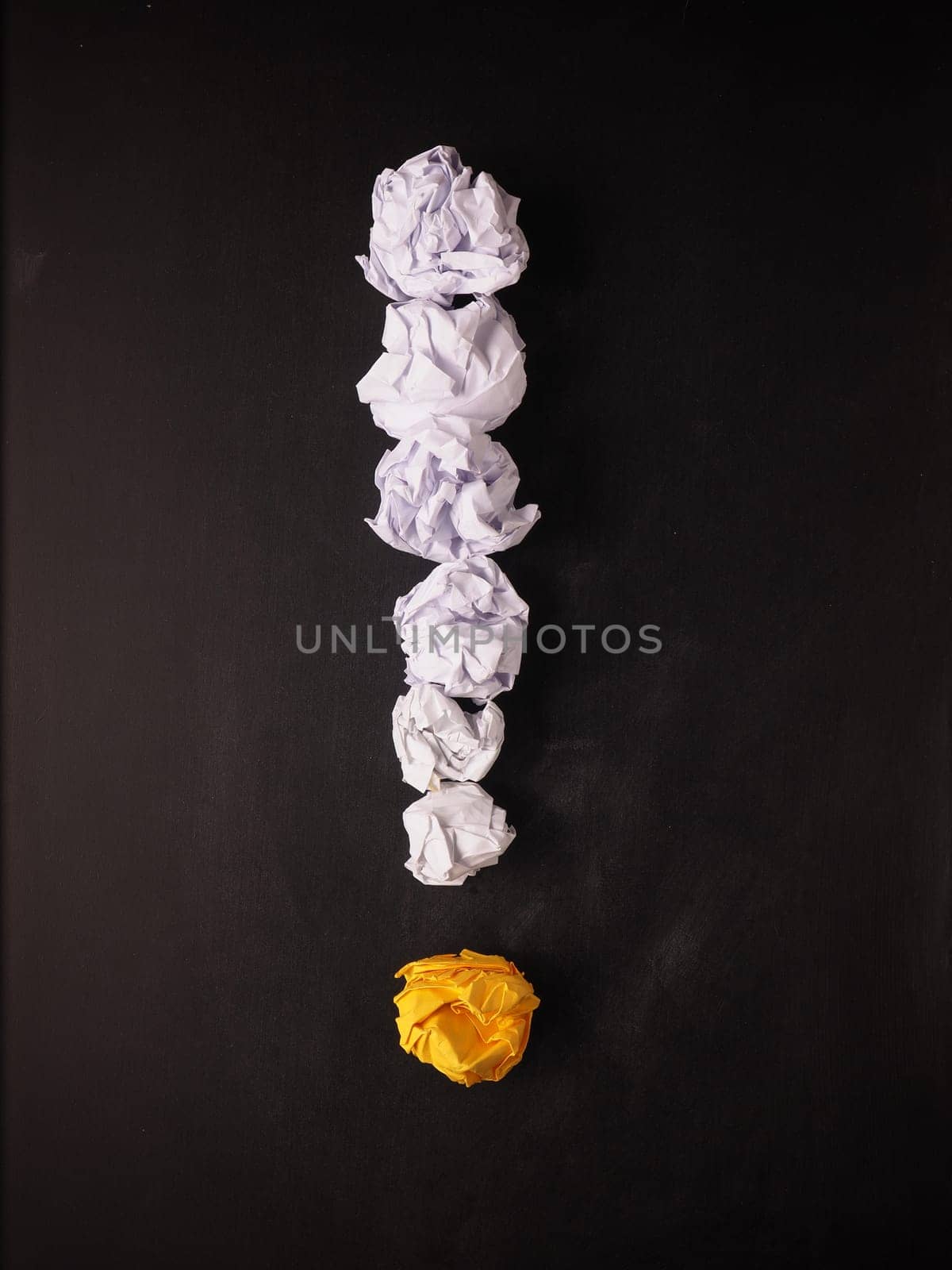 Crumpled paper on a blackboard as symbol of new great ideas
