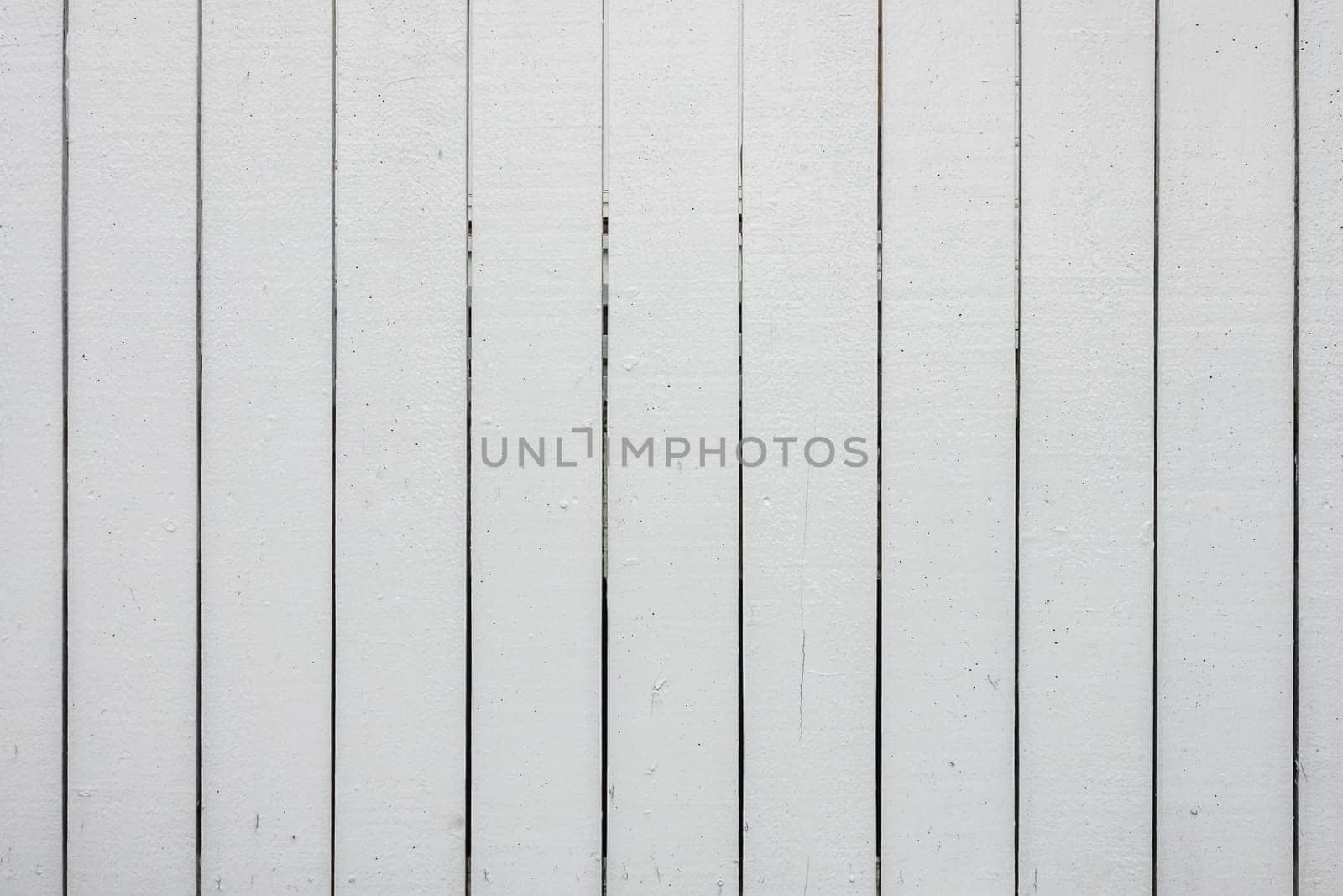 Close up of an old withered white fence that can be used as background or overlay