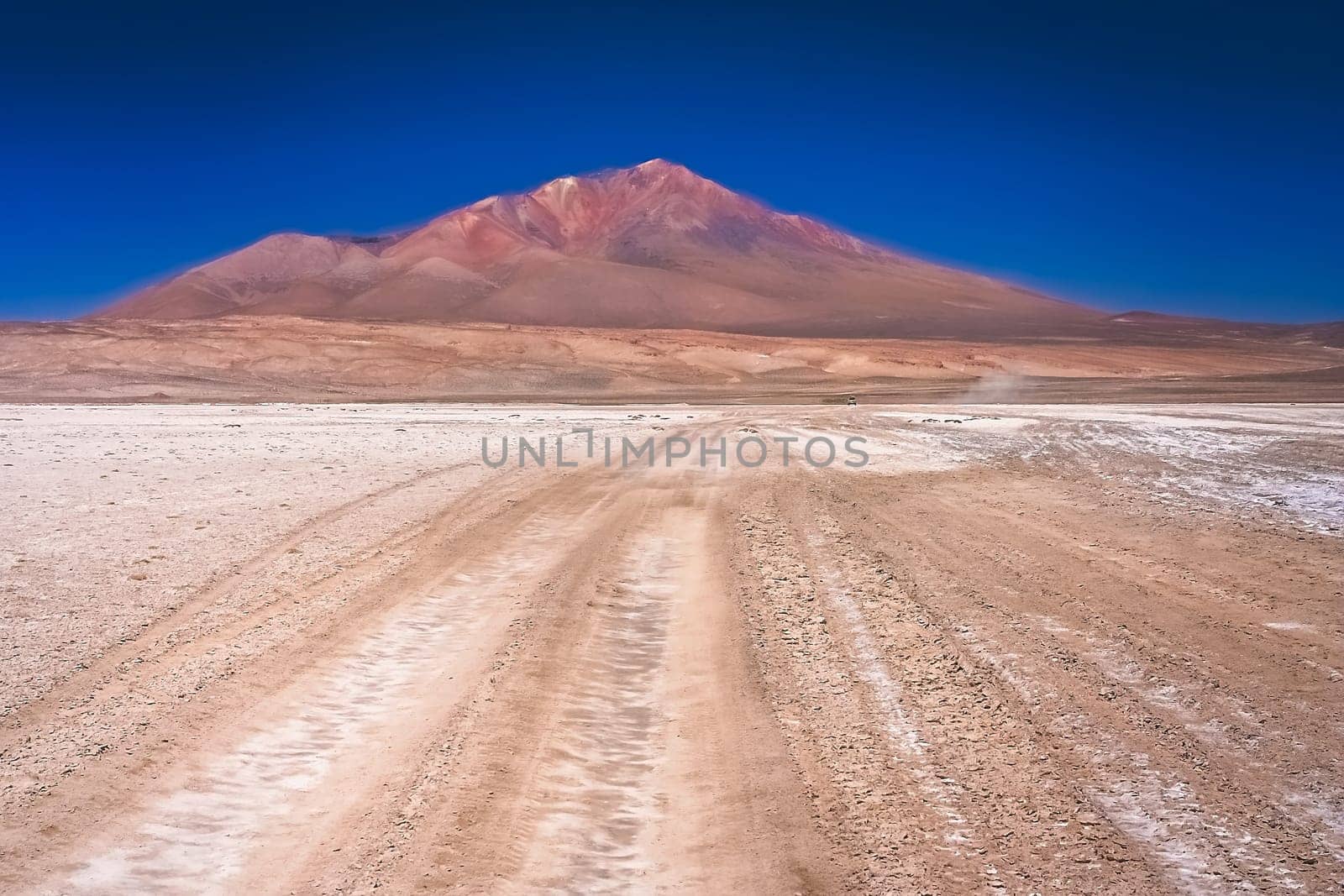 Sandy and gravel desert road through remote part of southern Altiplano, Bolivia
