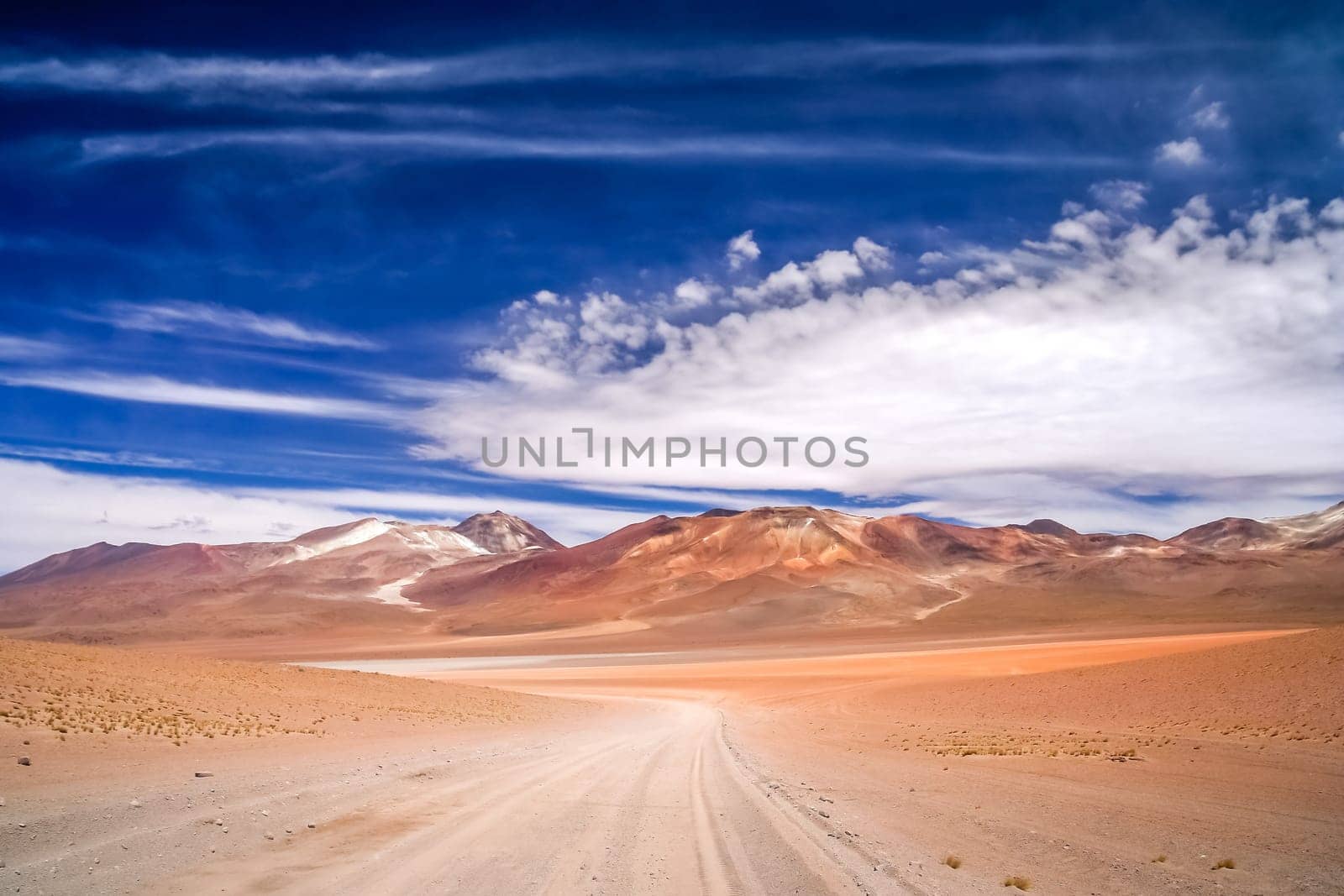 Sandy and gravel desert road through remote part of southern Altiplano, Bolivia