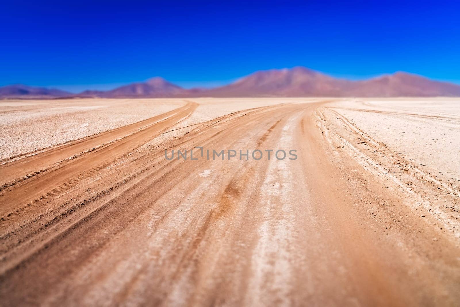 Gravel and corrugated desert road through remote part of southern Altiplano, Bolivia