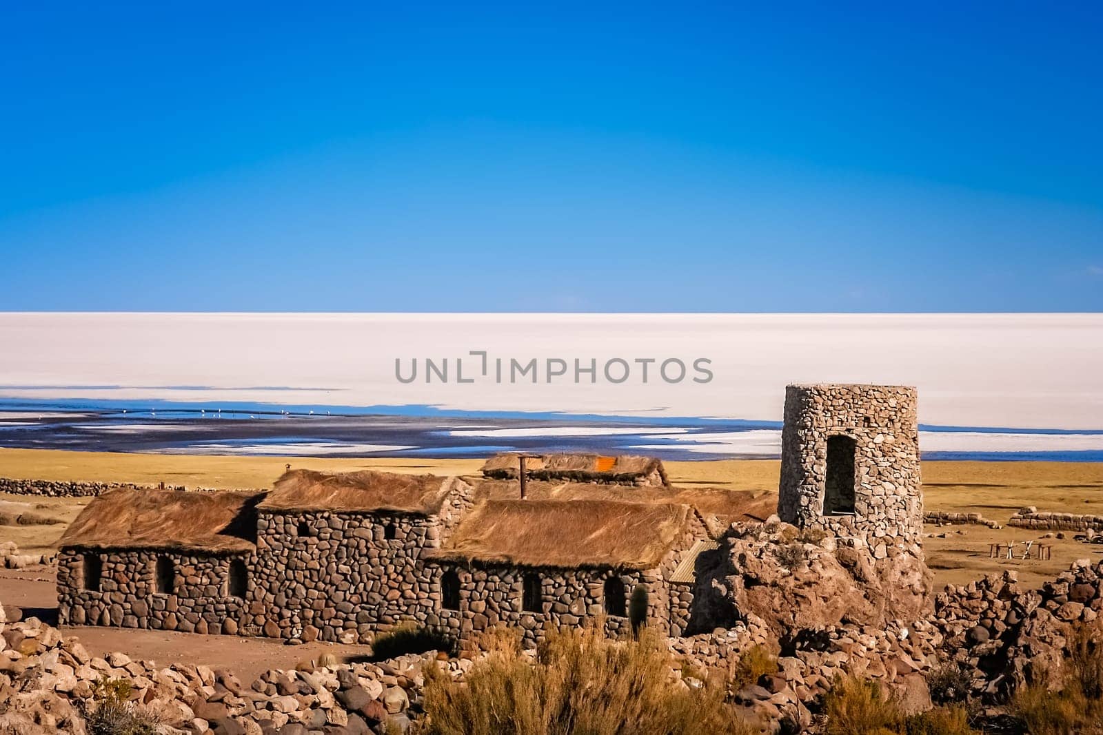 Old primitive abandoned building in a tiny village on the shore of Salar de Uyuni in Bolivia