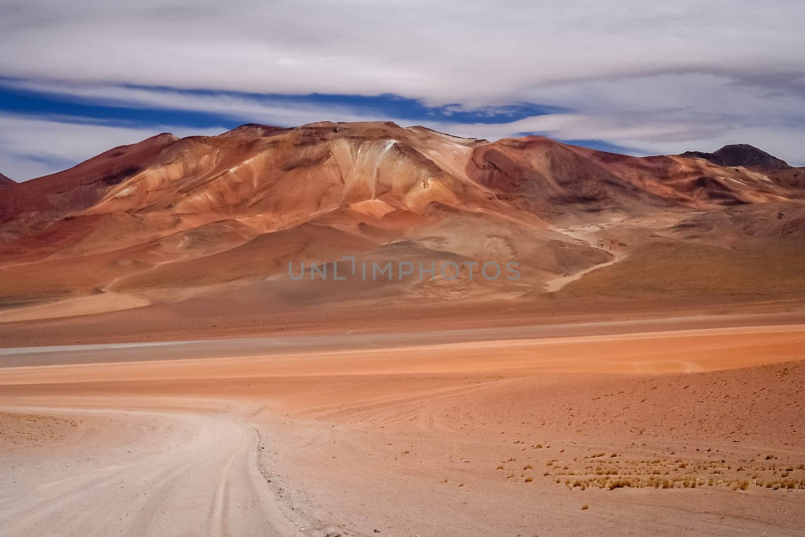 Sandy and gravel desert road through remote part of southern Altiplano, Bolivia