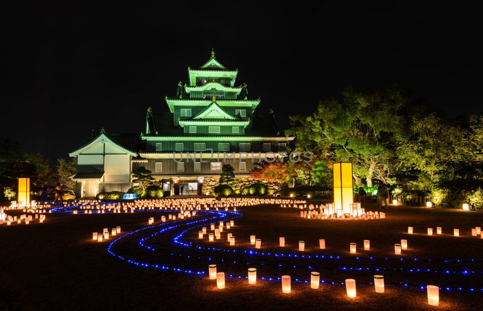 Night illumination with Japanese lanterns of Okayama castle or Crow castle in Okayama, Japan