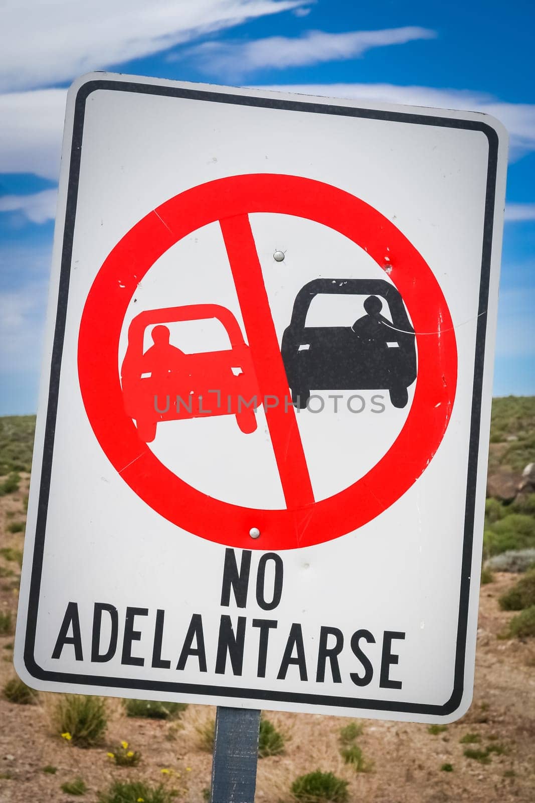 Sign forbidding overtaking on the winding mountain road in Argentina