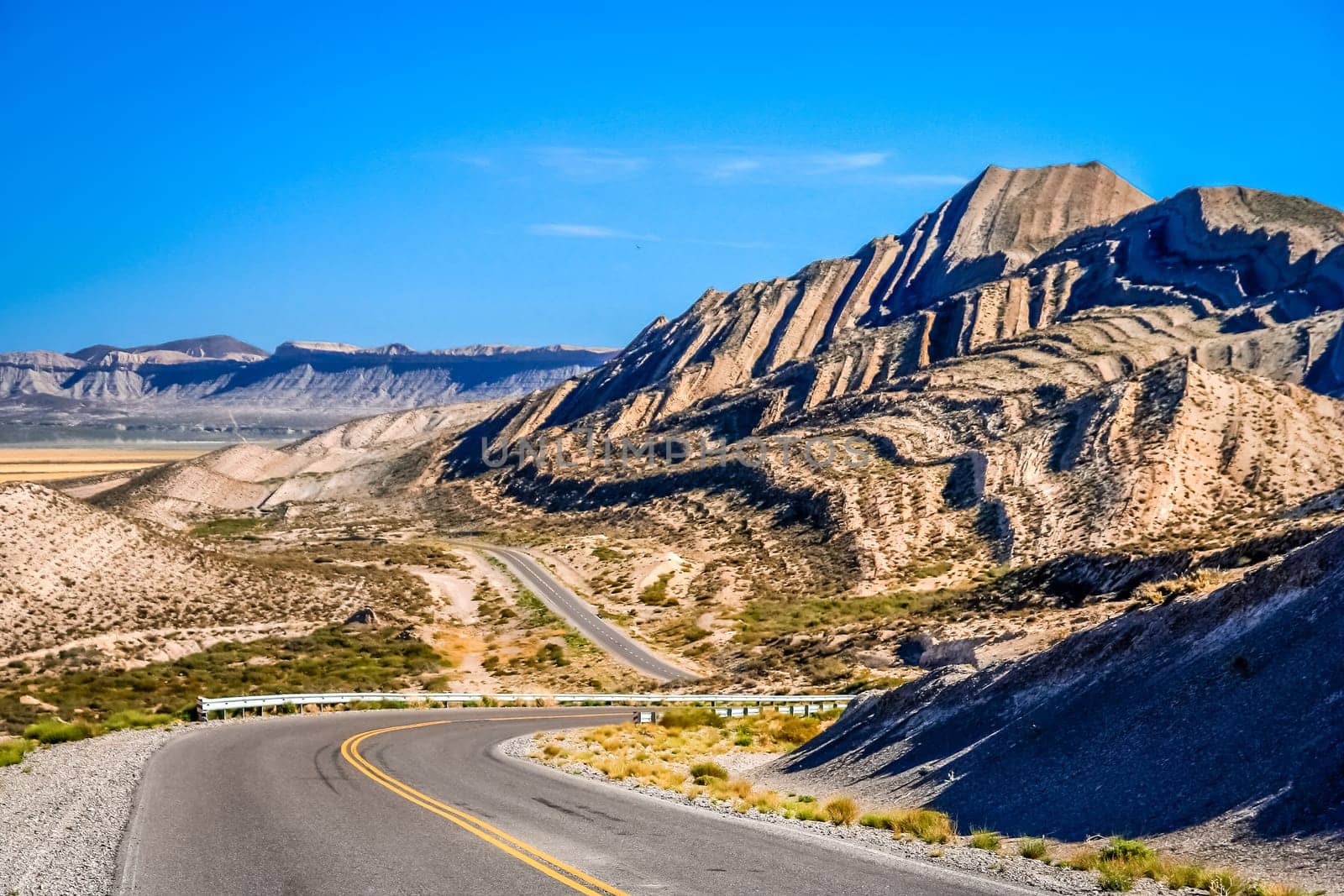 Famous Ruta 40, known as Ruta Quarenta, passing through some impressive and strangly shaped mountains in northern part of Argentina