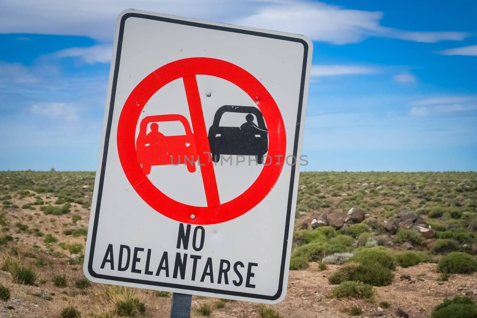 Sign forbidding overtaking on the winding mountain road in Argentina