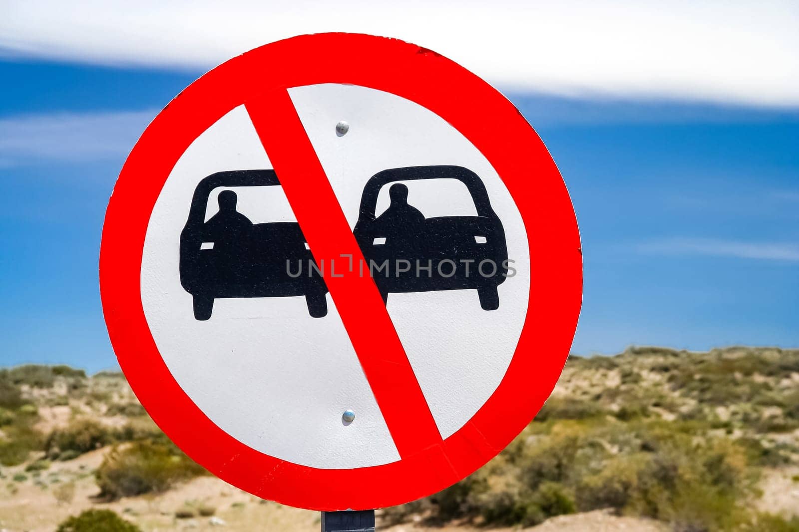 Sign forbidding overtaking on the winding mountain road in Argentina
