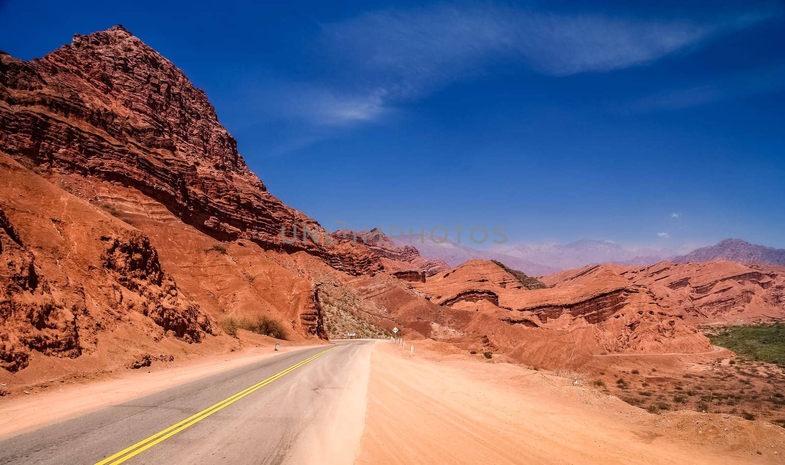 Road through colourful polychromic mountains in Northern Argentina