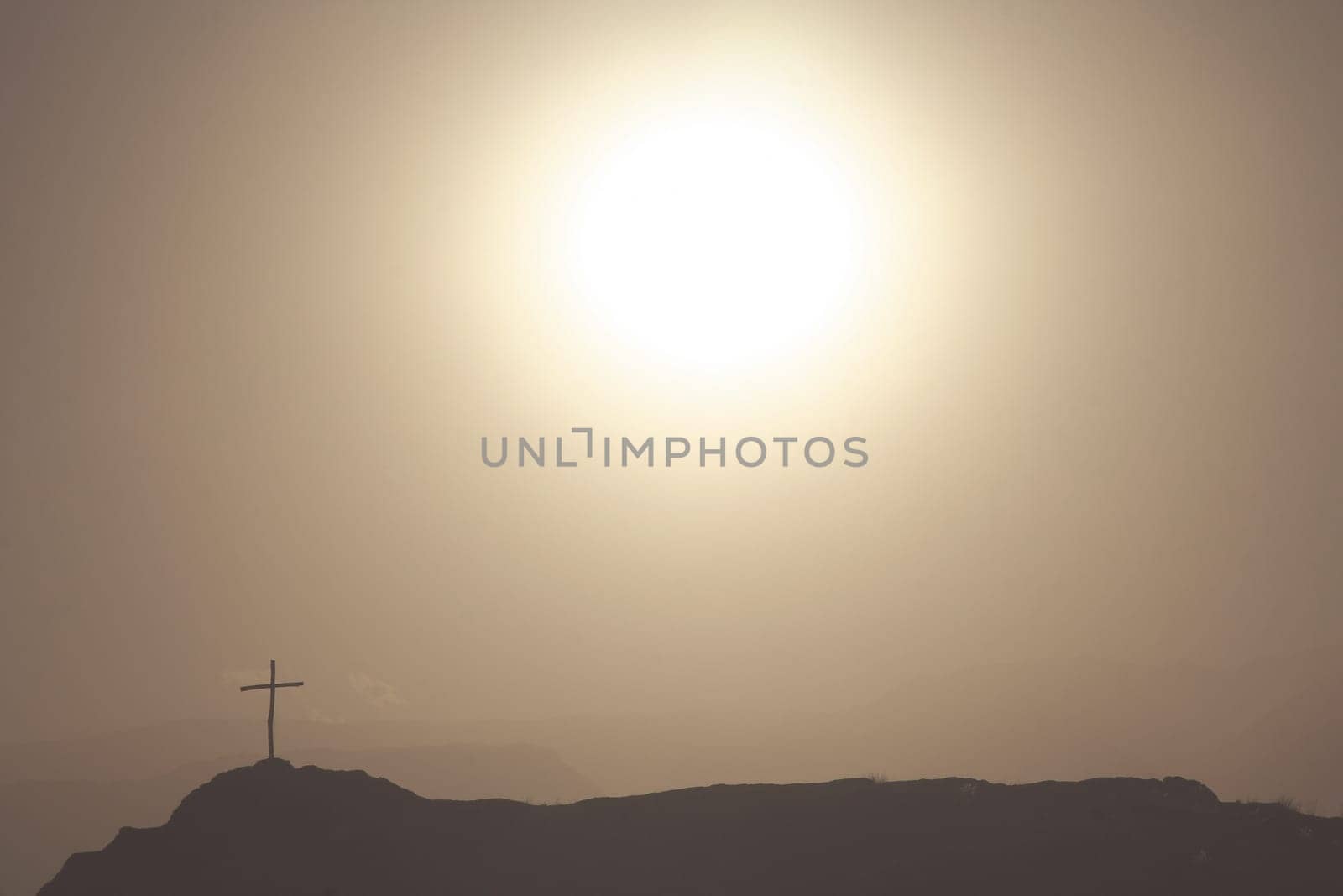 Cross on the rock in argentinian mountains