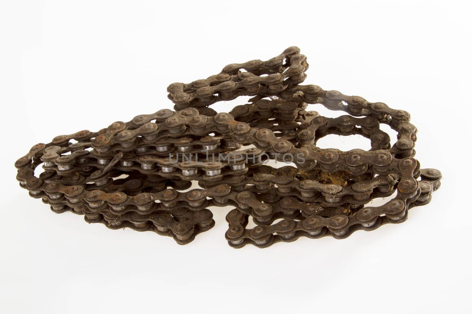 Old bicycle chain on a bright background