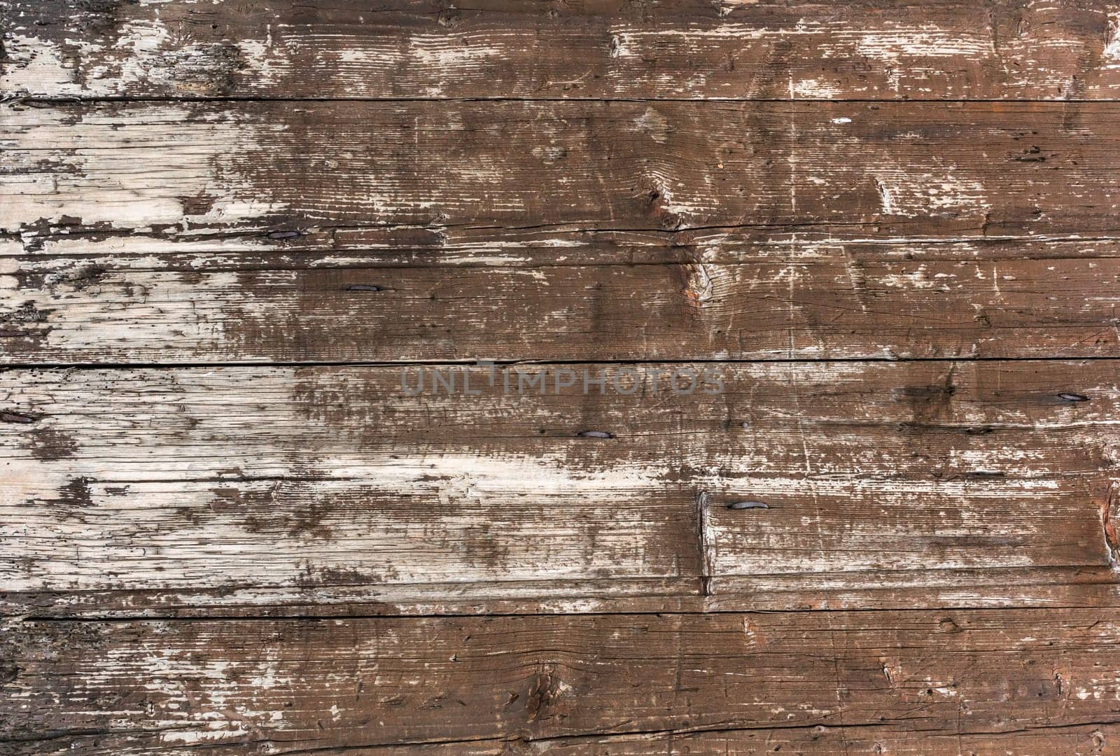 Old wooden plankswith peeling paint. Background of old painted wood fragment.
