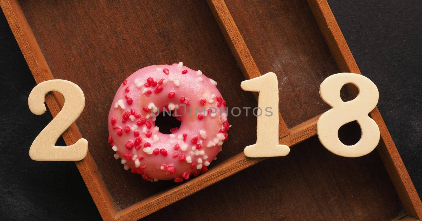 Sweet pink donut with the number 2018, sweet New Year concept