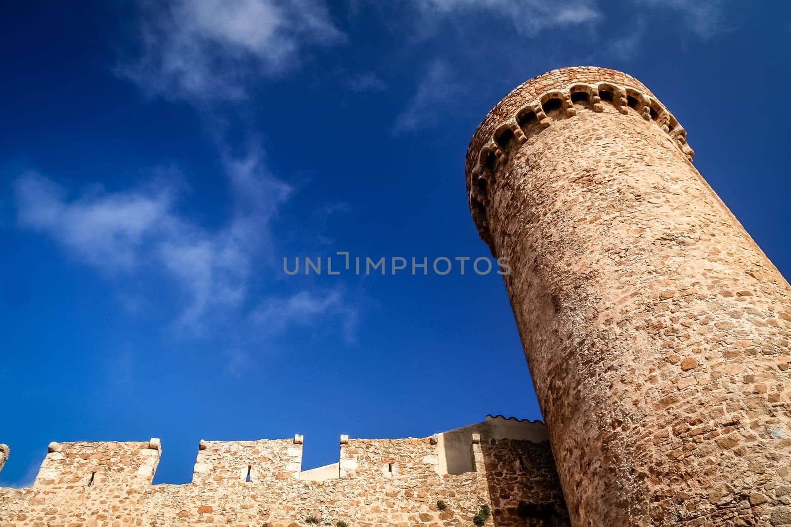 Tower and walls of the Tossa de Mar castle in Costa Brava, Catalunya, Spain