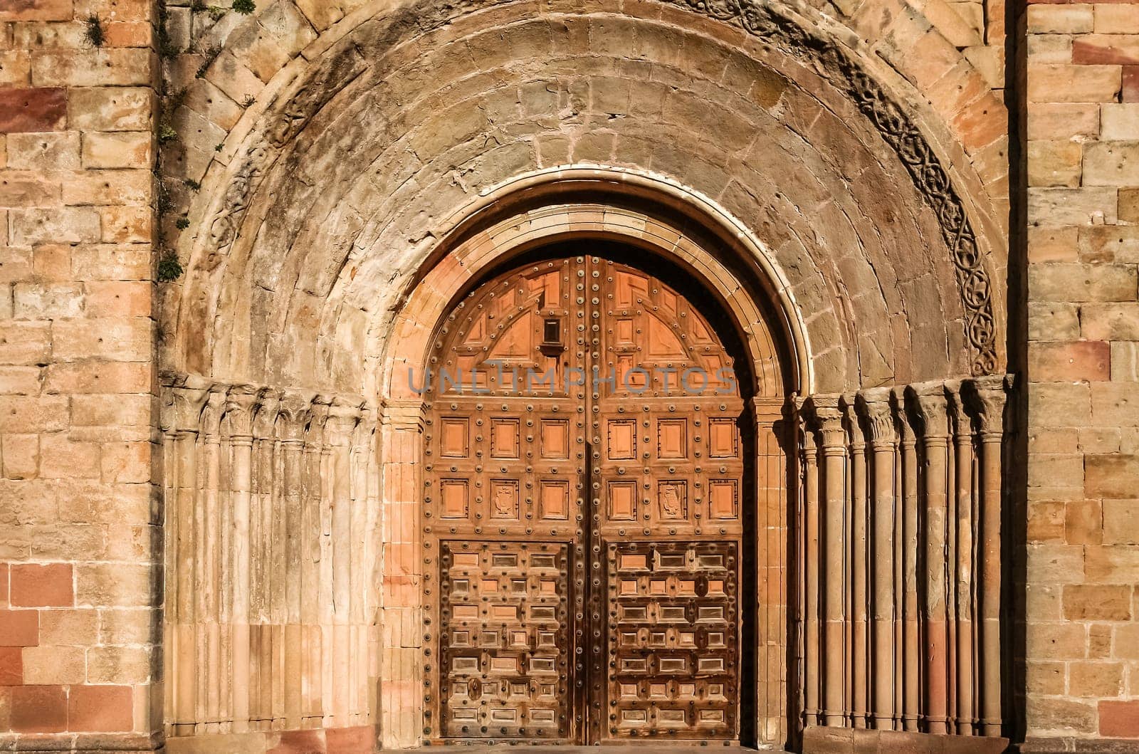 Front gates to the impressive Cathedral in an old part of city Siguenza in Spain