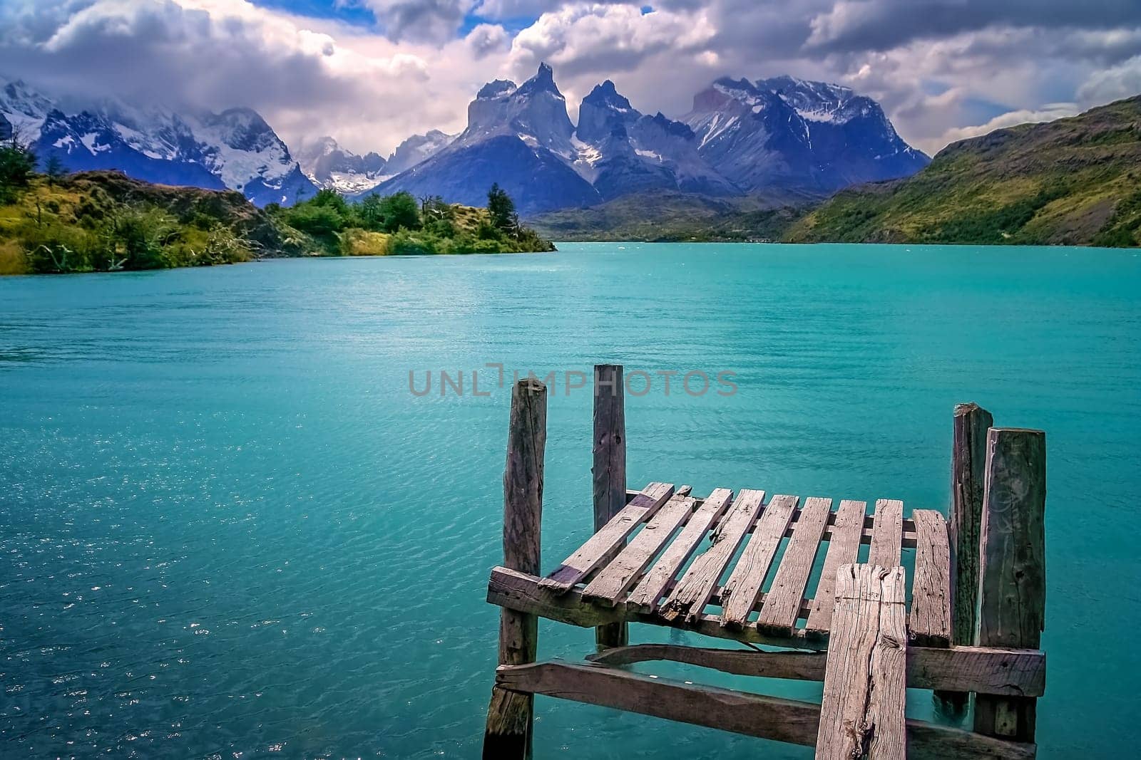 Wooden platform on a lake with a view of Cuernos del Paine, Patagonia, Chile