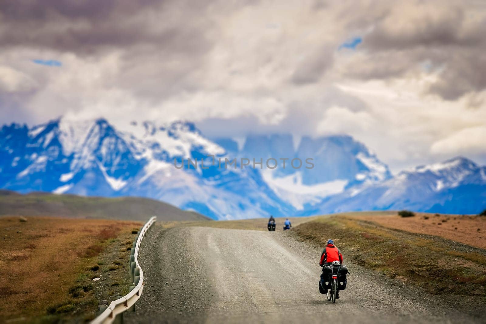 Girl cycling in Torres del Paine National Park, Chile, South America