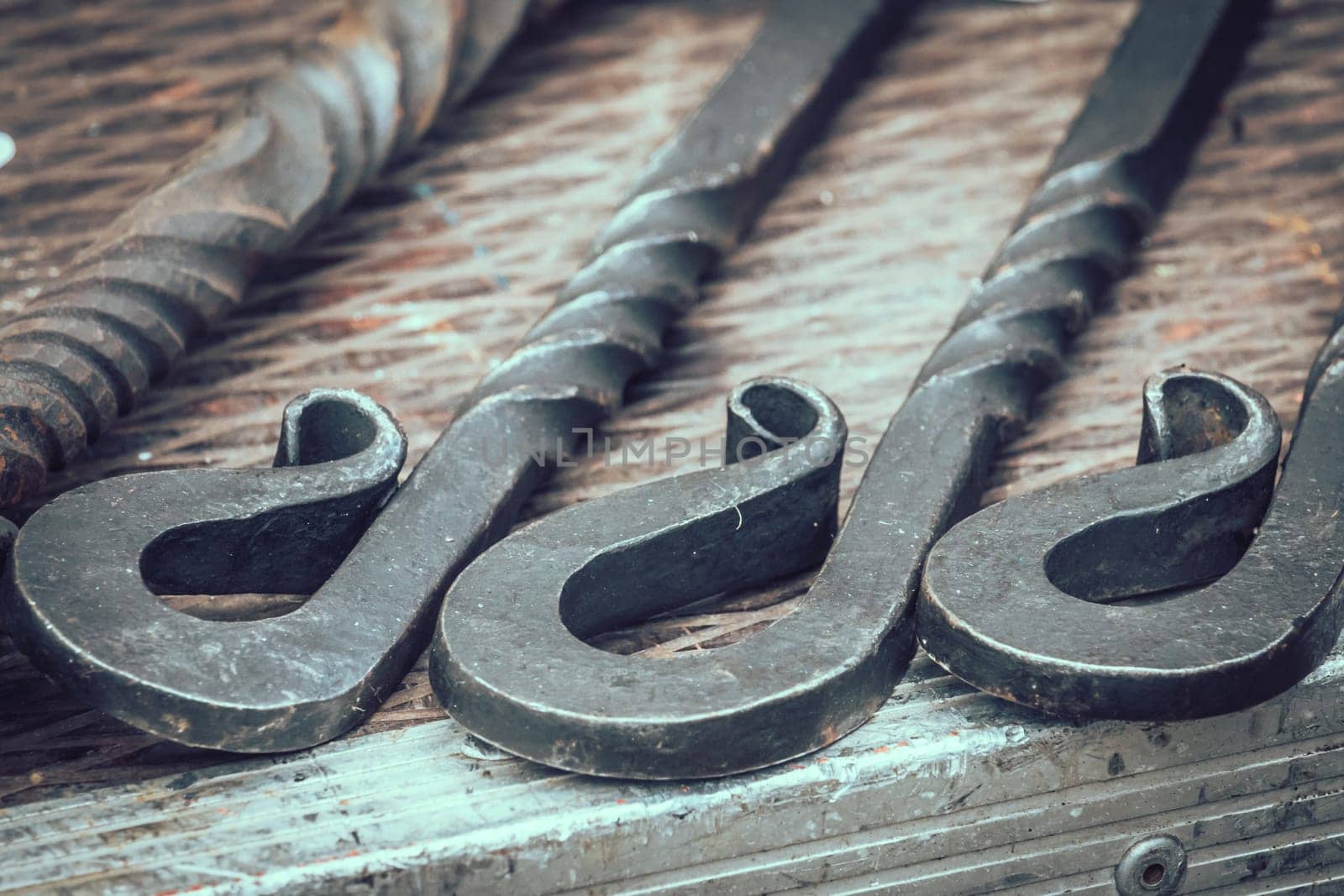 Steel rods and objects on a table, summer medieval fair, Streatham, London
