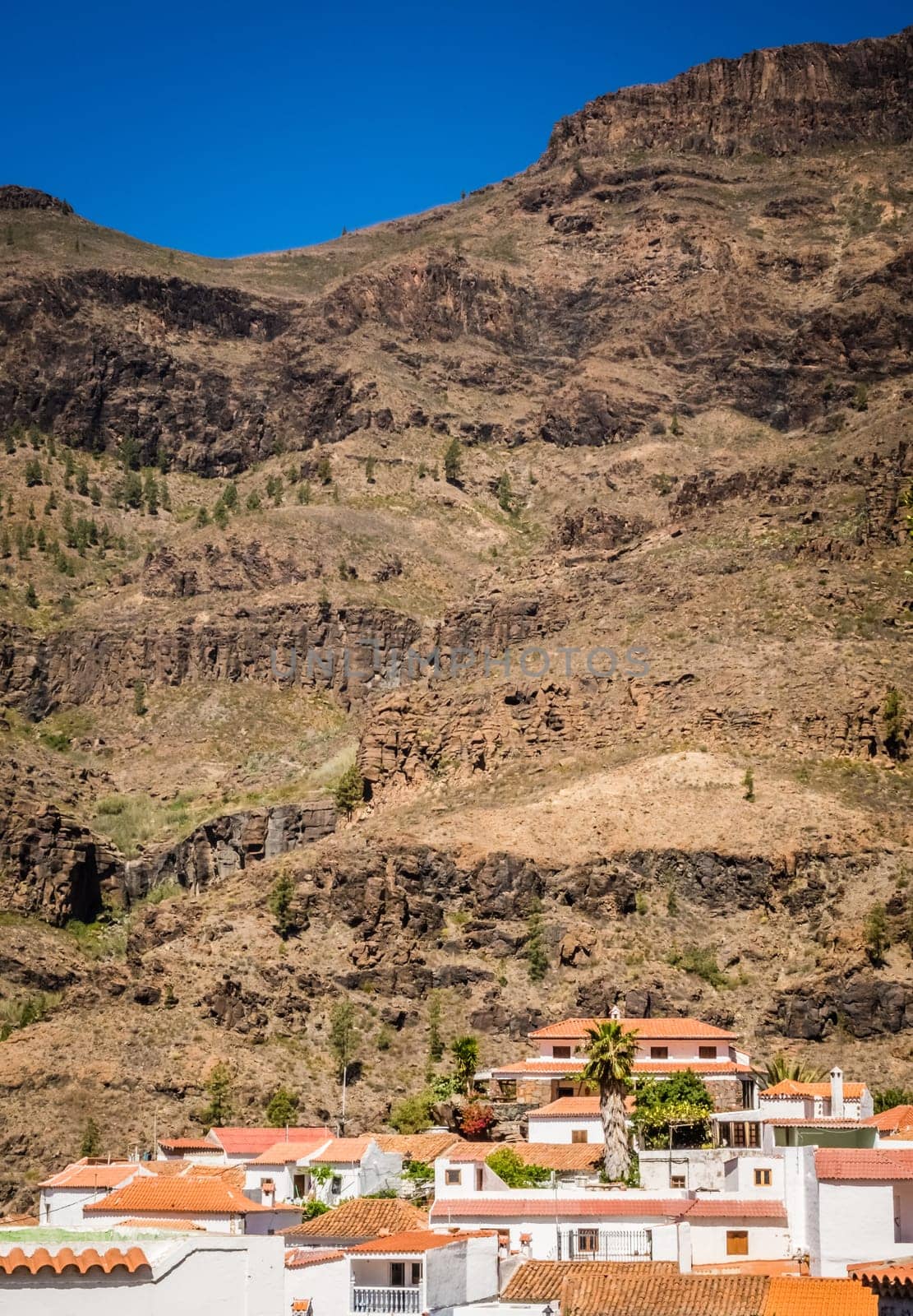 View of the tiled roofs oh homes in a small town of Fataga in Gran Canaria, Canary Islands, Spain