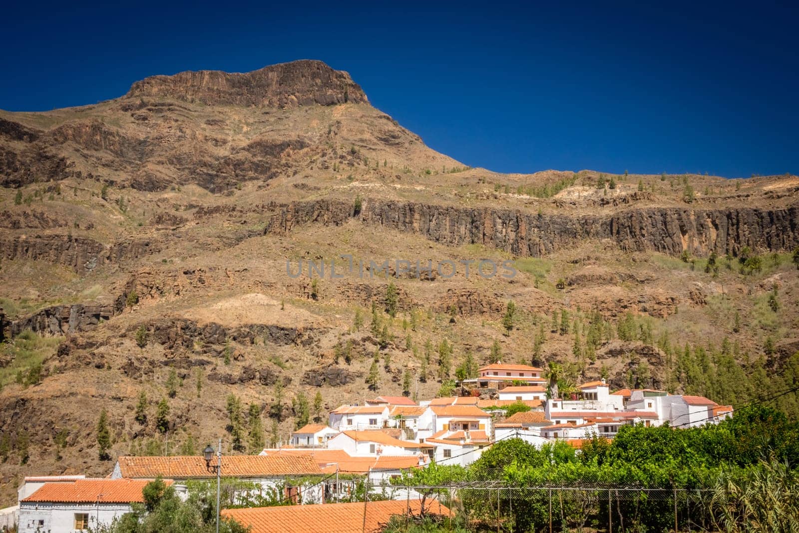 View of the tiled roofs oh homes in a small town of Fataga in Gran Canaria, Canary Islands, Spain