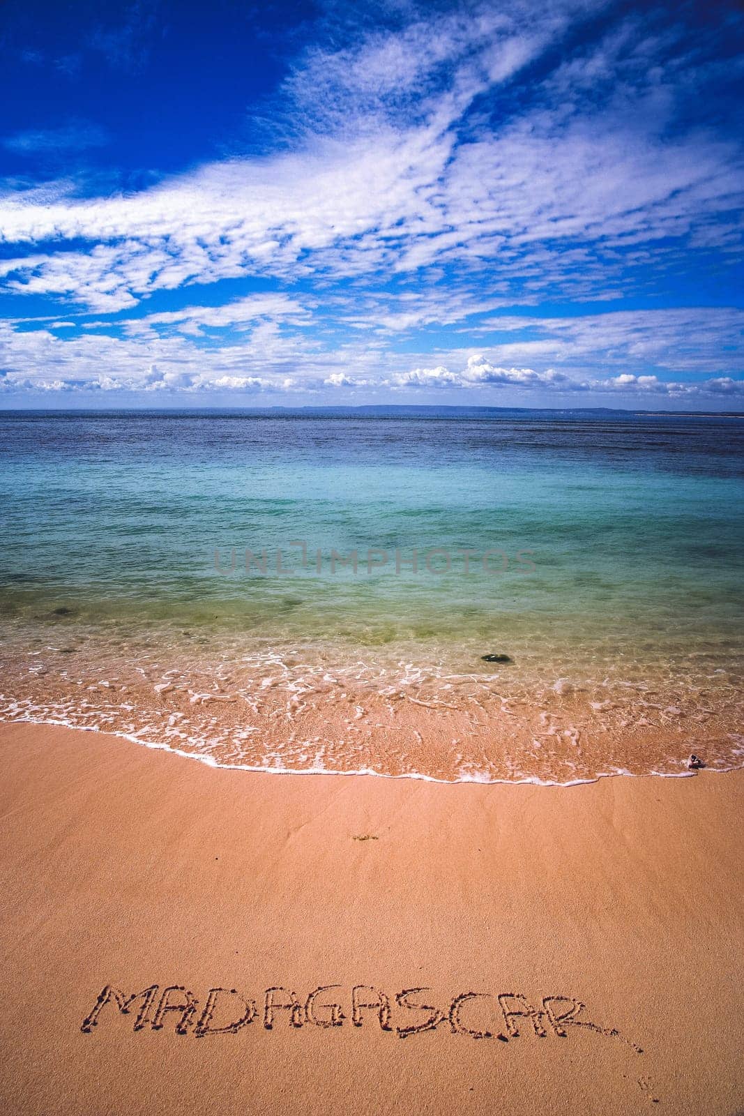 Word Madagascar written on a sand near fishing village Anakao