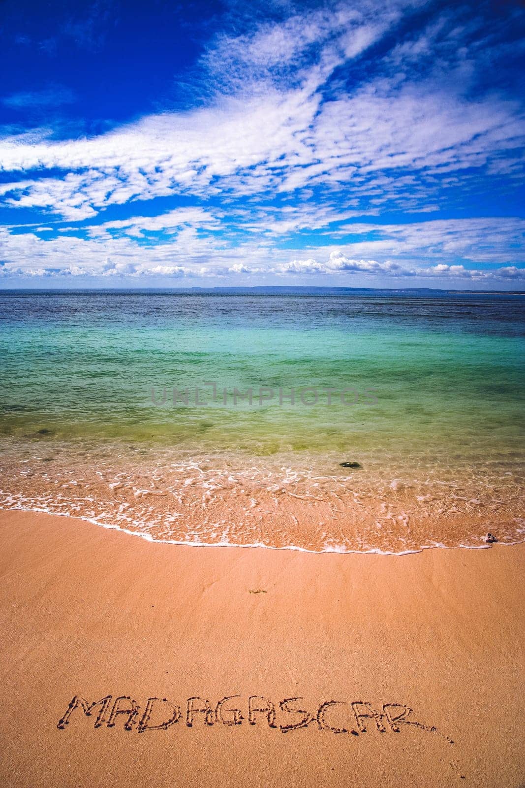 Word Madagascar written on a sand near fishing village Anakao