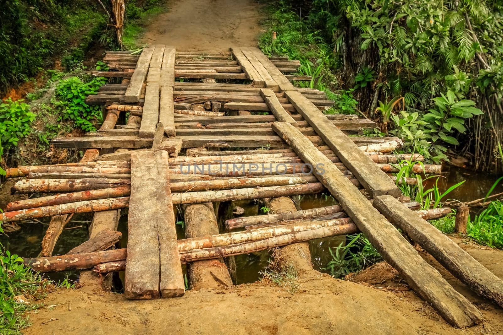 Small wooden bridge on the rural road to Maroantsetra
