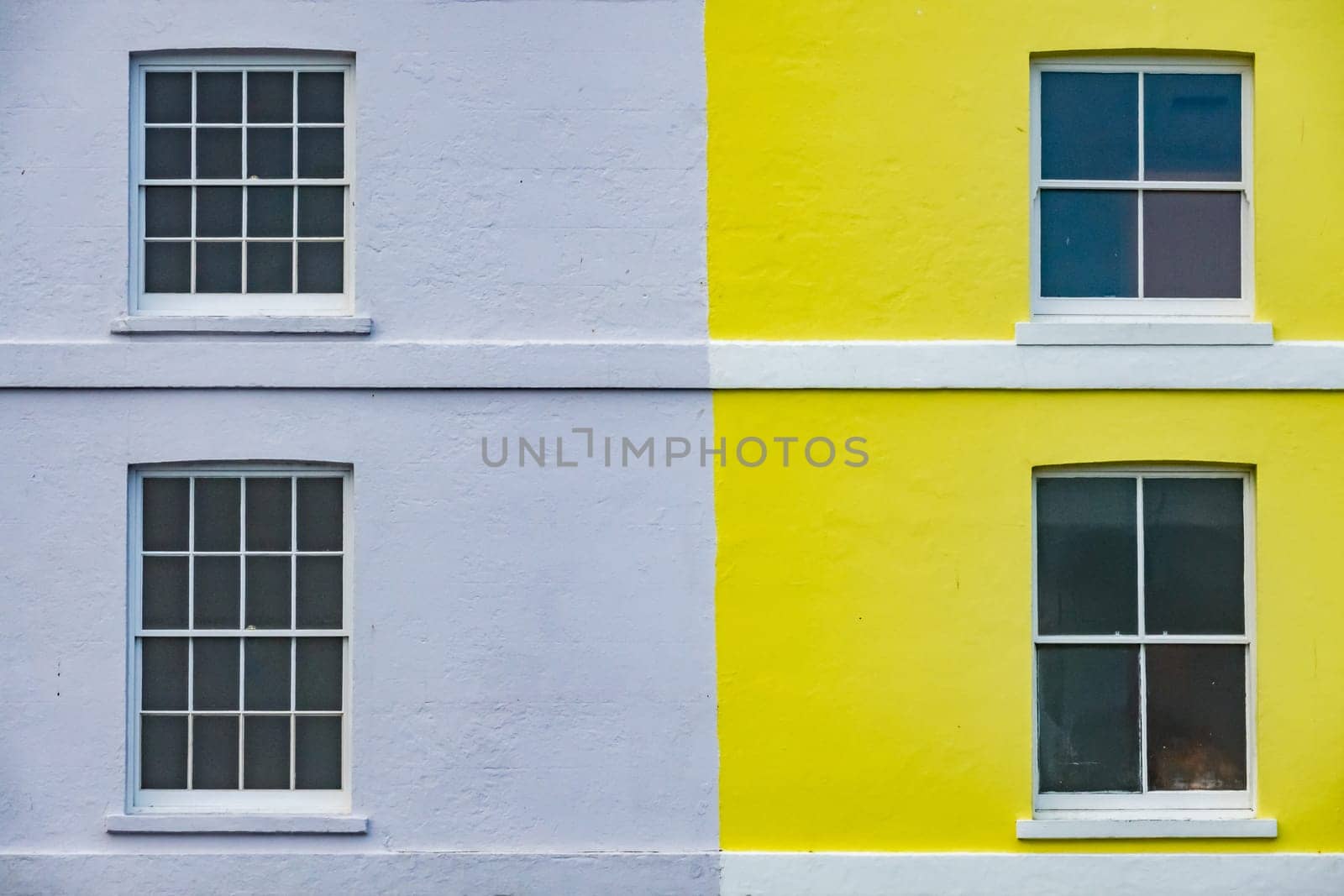 Colorful yellow and blue home facade in Hastings, England, UK