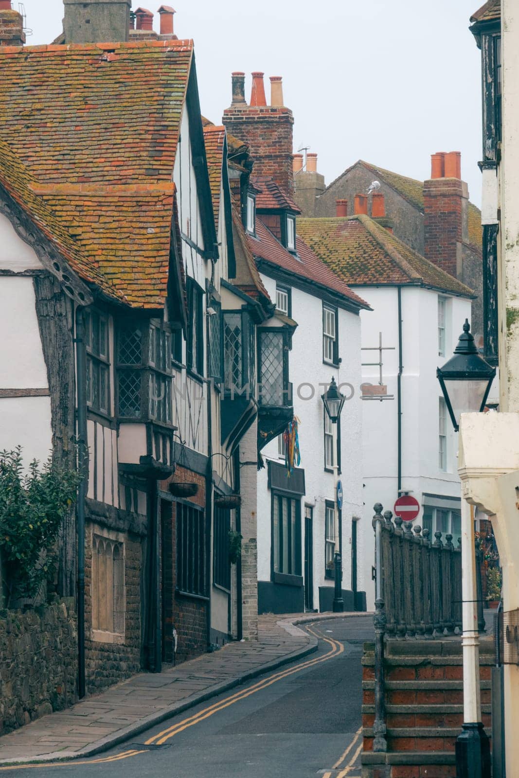 Old street with colorful houses in the town of Hastings, East Sussex, England, UK