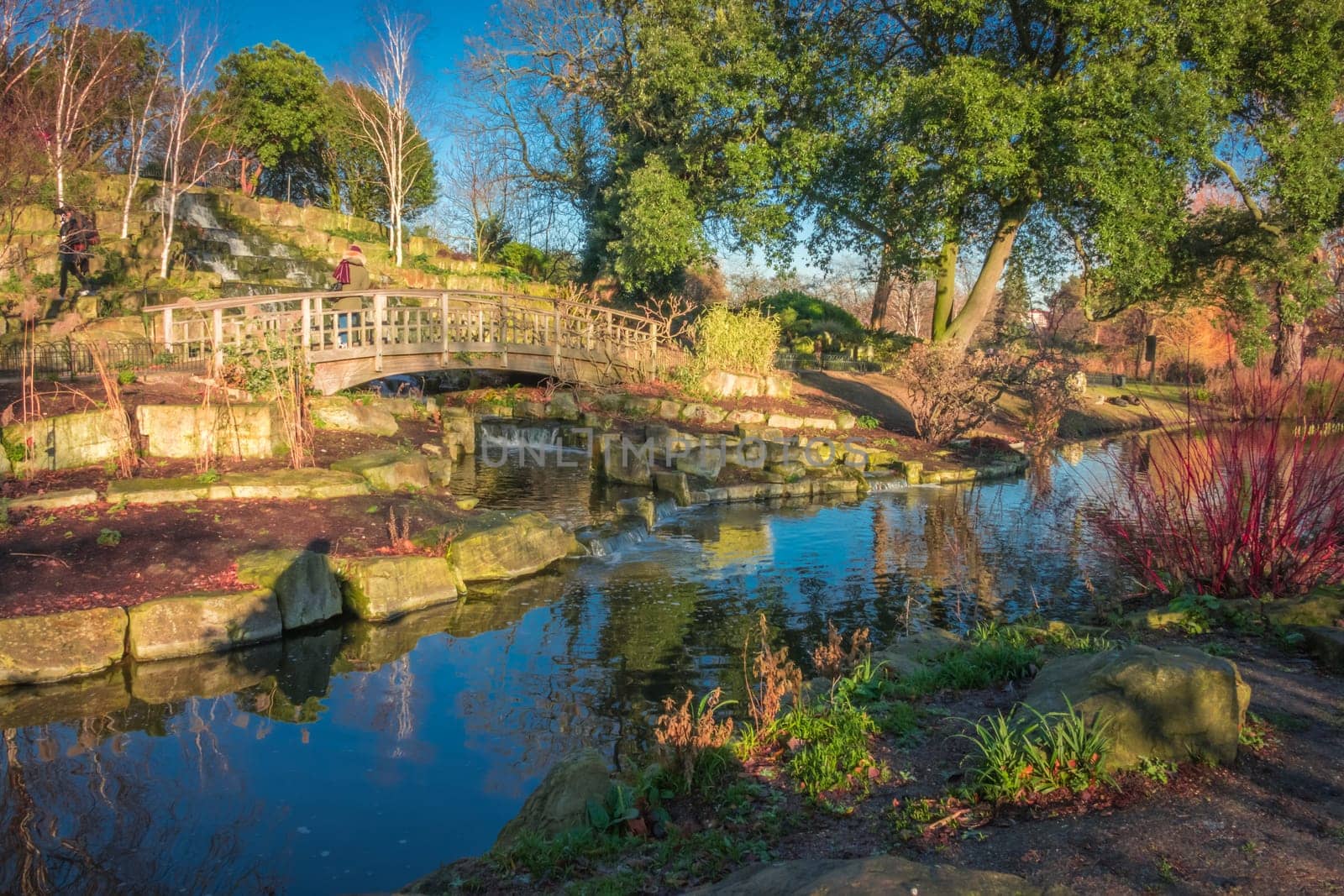 Panoramic picture of a small lake and public footpath  in Regents Park, London