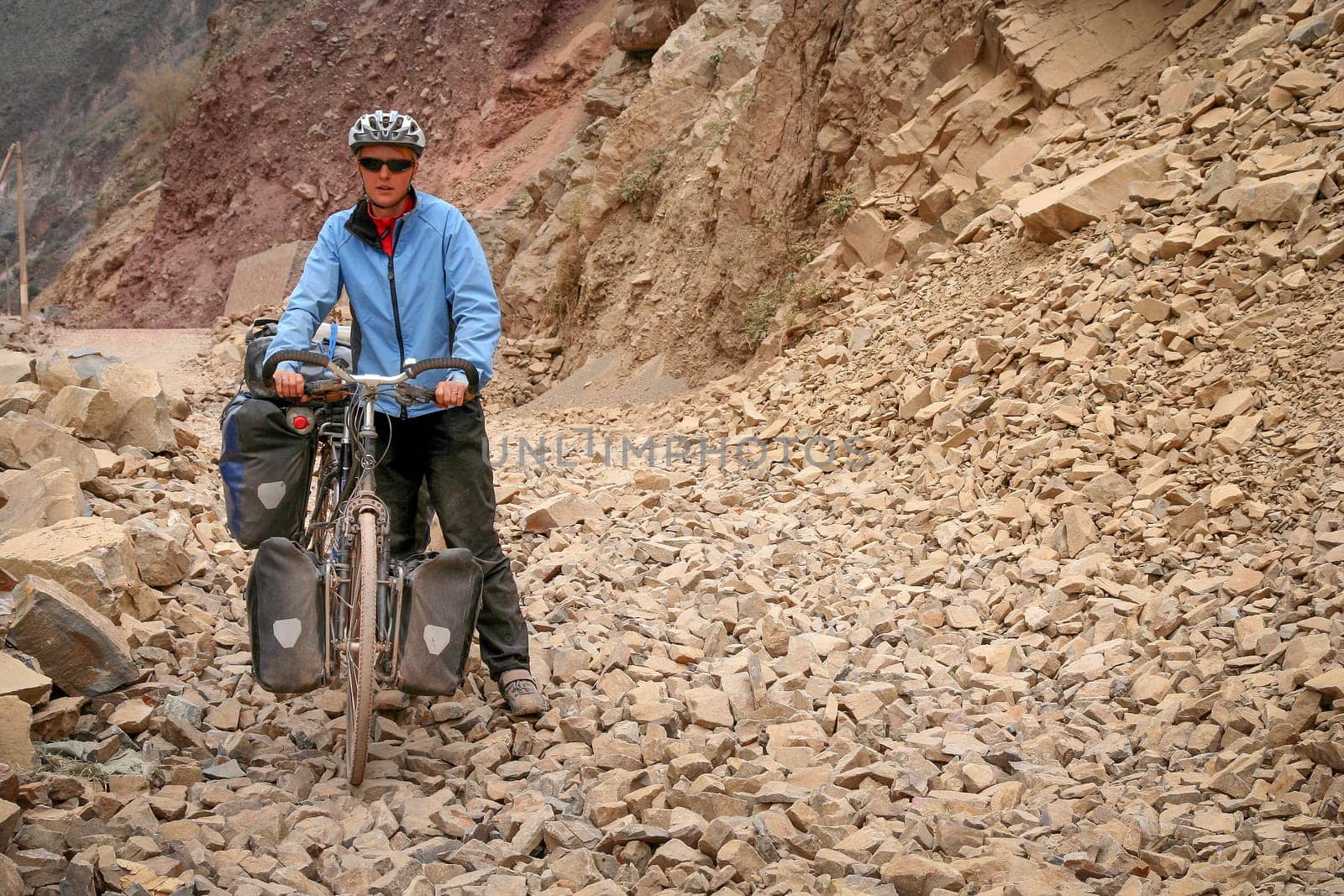 Cycling through remote mountain road between Tibet and Yunnan in China