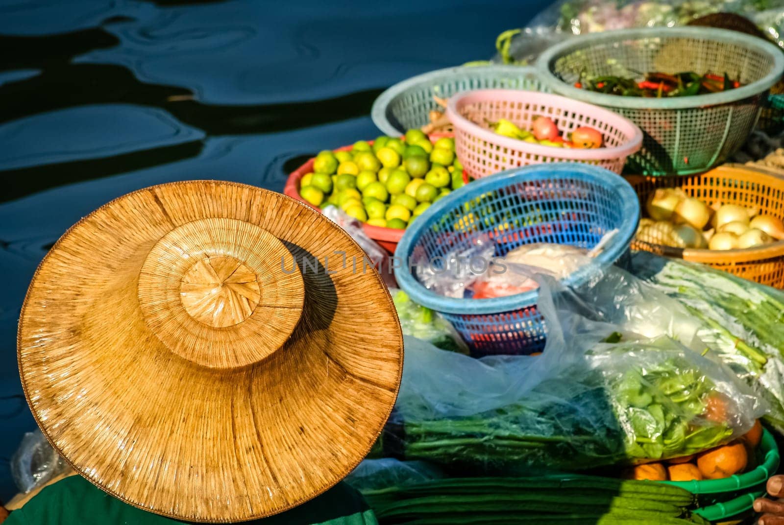 Fruits sale from the boat on the floating market in Thailand