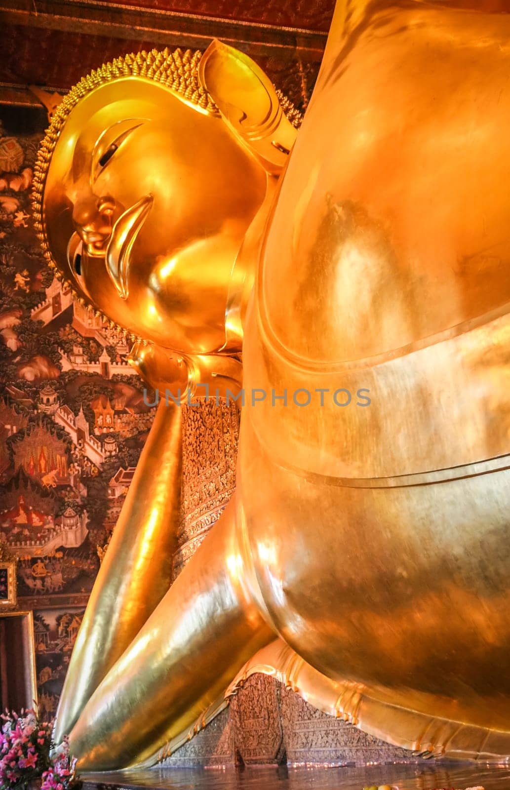 Head of the Reclining Buddha in a temple in Bangkok,  Thailand