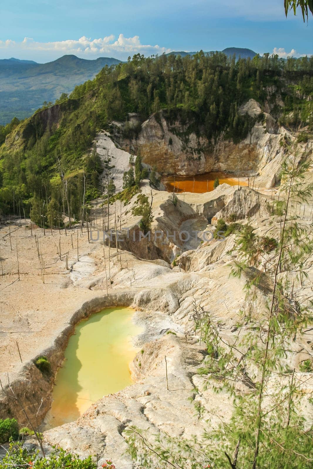 Crater lakes of stunning Wawo muda volcano in Flores in Indonesia