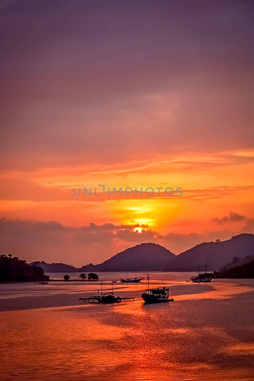 Sunset over bay in Labuhan Bajo town on the Flores island, Indonesia