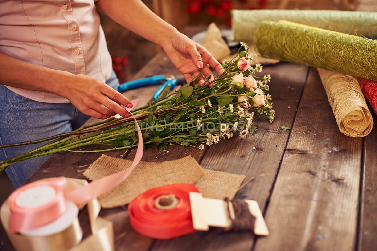 Woman working over bouquet