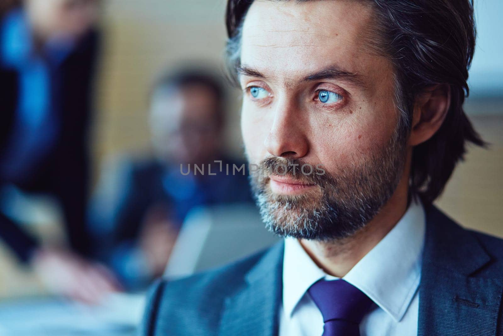 Close-up of face of manager looking away