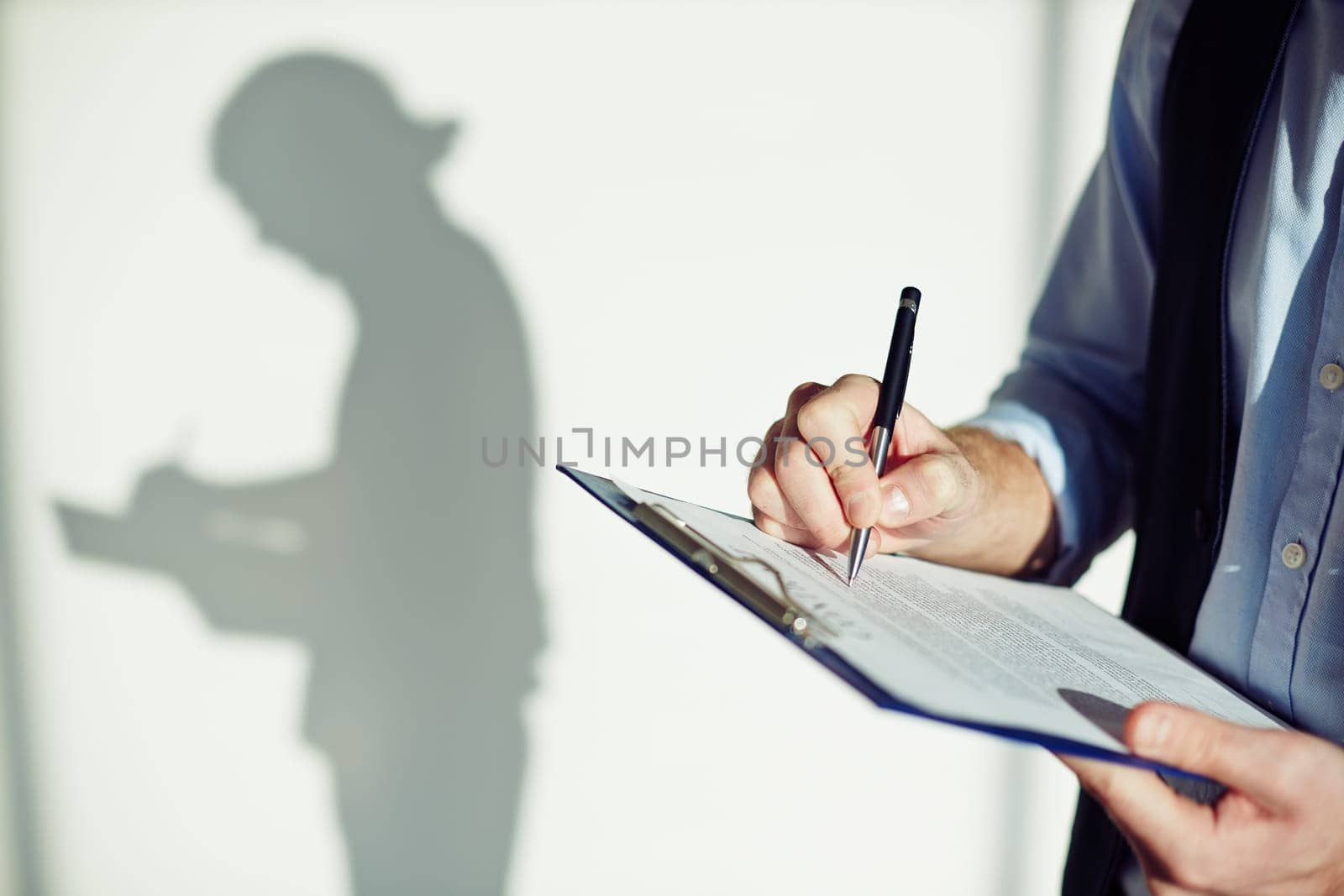 Man filling in document