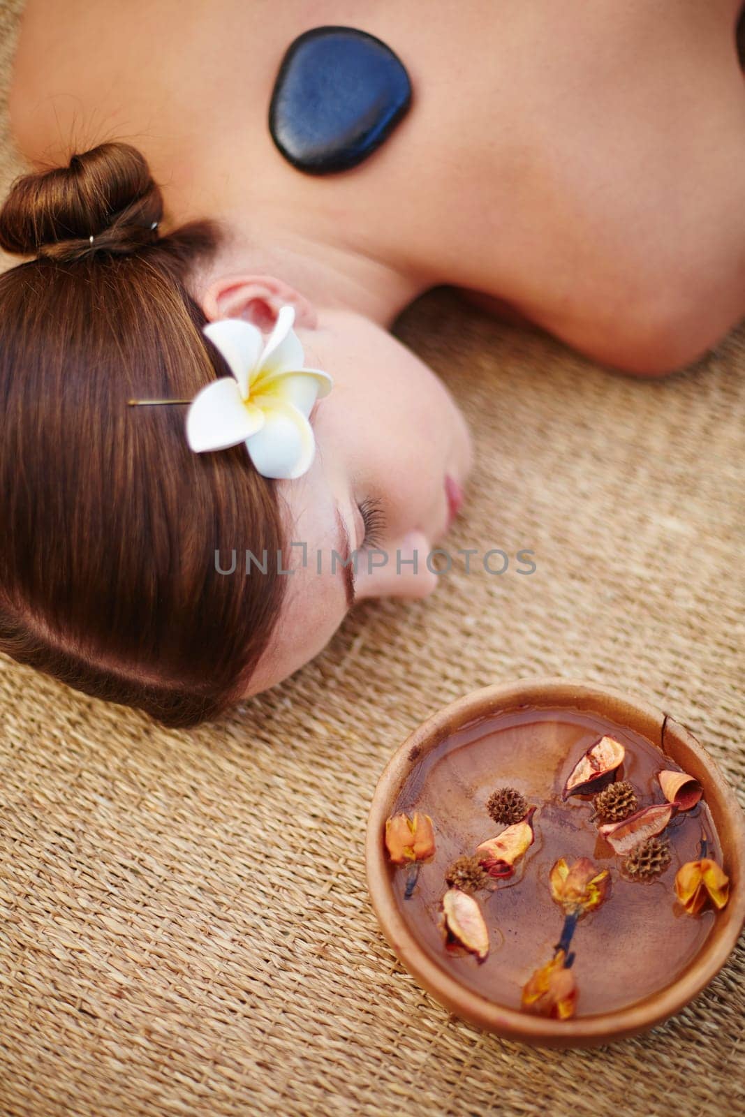 Young girl having relaxing massage in spa salon