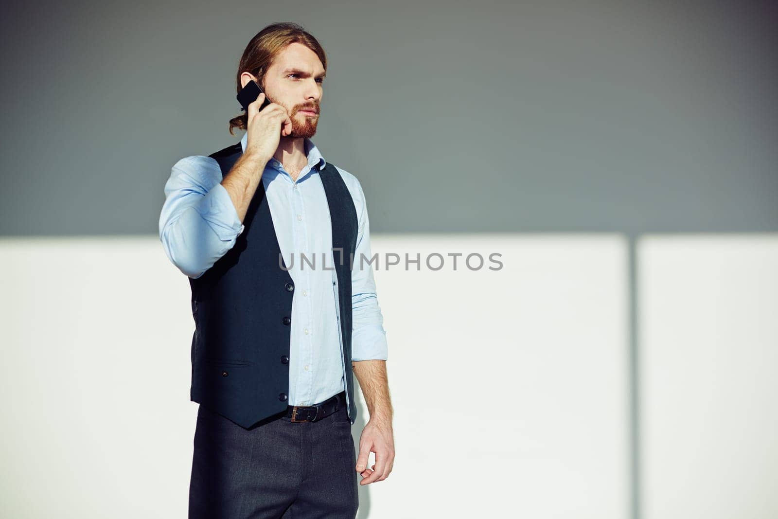Serious man talking on the phone